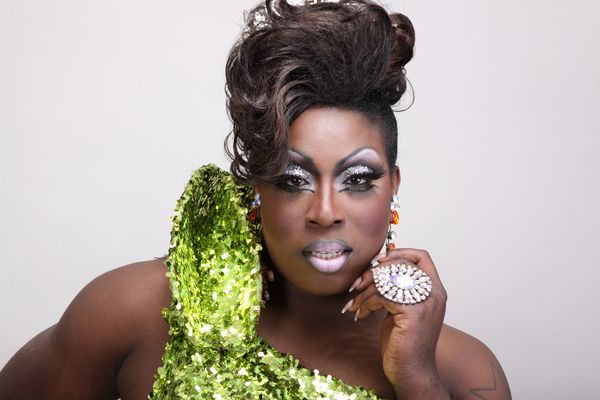 A fabulous drag queen in a sparkly green dress