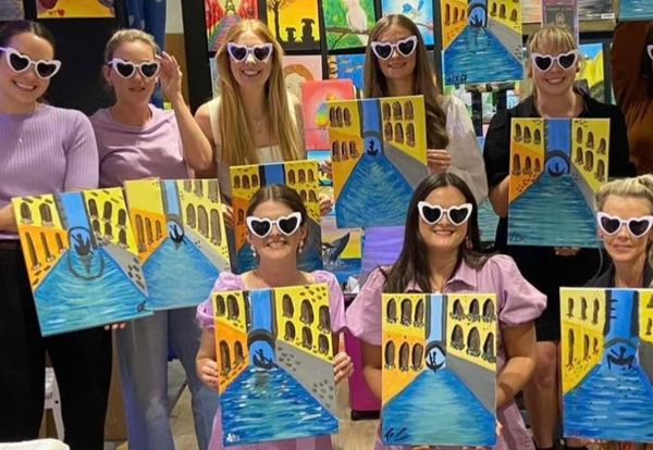 Hens in heart sunglasses holding up their Venice canal paintings