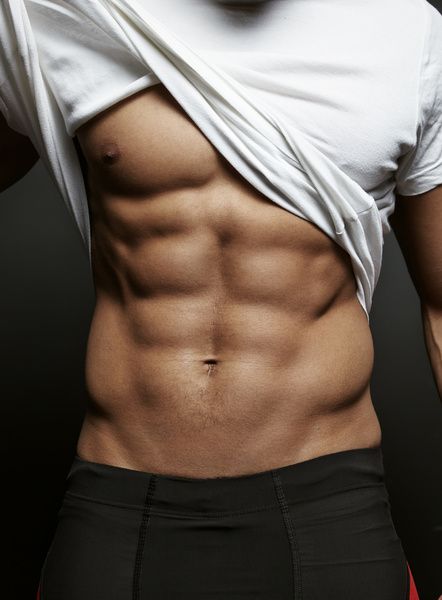 Muscular topless waiter lifted his shirt to flaunt his perfect abs
