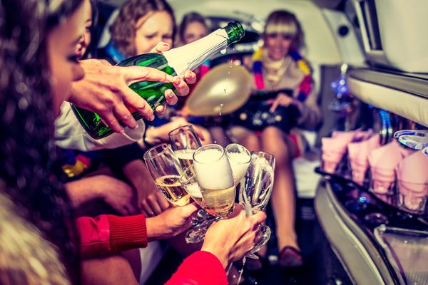 Limo ride with bubbly champers for bride to be and friends having a great time