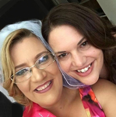 Two hens cheek to cheek, one in a veil, from Melissa's own photos
